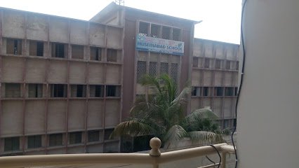 Hussein Ebrabim Foundation school logo